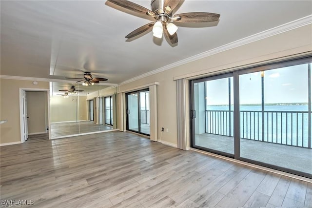 1910 Virginia Ave Unit 1302, Fort Myers, FL 33901 - unfurnished room with ceiling fan, light wood-style floors, crown molding, baseboards, and a water view