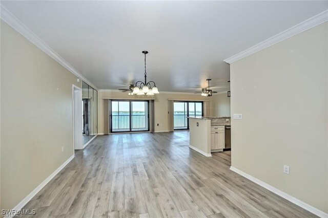 1910 Virginia Ave Unit 1302, Fort Myers, FL 33901 - unfurnished living room featuring a chandelier, a ceiling fan, ornamental molding, light wood finished floors, and baseboards