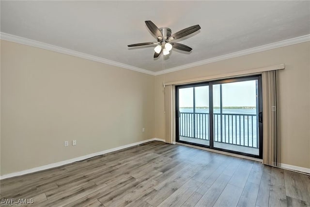 1910 Virginia Ave Unit 1302, Fort Myers, FL 33901 - empty room featuring a ceiling fan, wood finished floors, baseboards, and ornamental molding