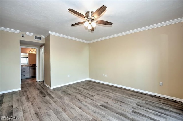 1910 Virginia Ave Unit 1302, Fort Myers, FL 33901 - unfurnished room with a ceiling fan, ornamental molding, wood finished floors, and baseboards
