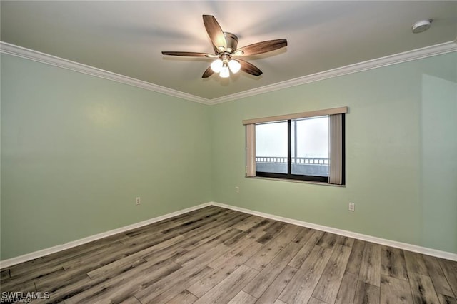 1910 Virginia Ave Unit 1302, Fort Myers, FL 33901 - empty room with wood finished floors, crown molding, a ceiling fan, baseboards, and a smoke detector