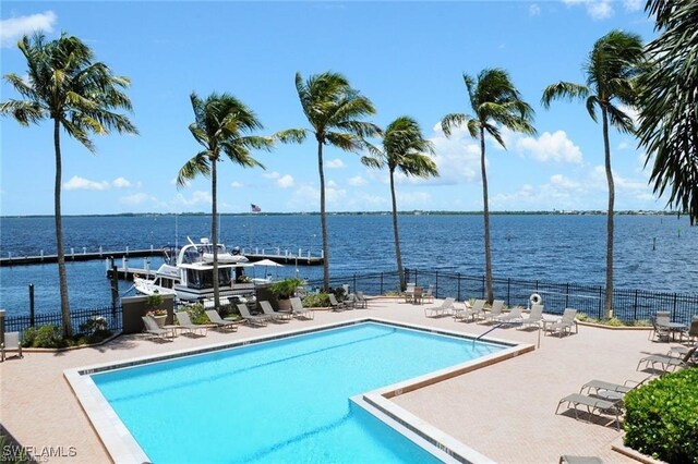 1910 Virginia Ave Unit 1302, Fort Myers, FL 33901 - community pool with a water view, fence, and a patio