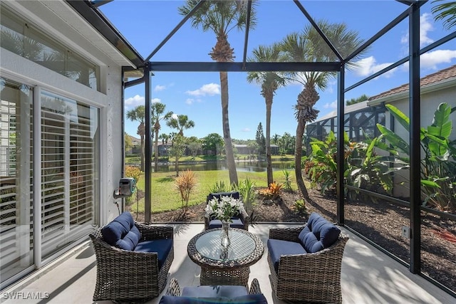 sunroom / solarium with a water view