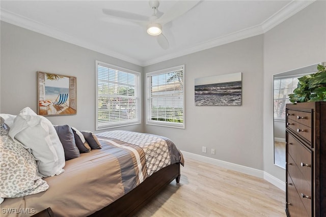 bedroom with crown molding, light wood-type flooring, baseboards, and ceiling fan