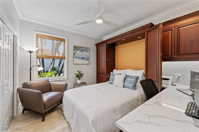 bedroom with ornamental molding, light wood finished floors, and a ceiling fan