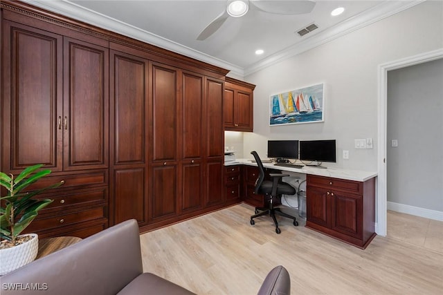 office featuring built in study area, crown molding, light wood finished floors, a ceiling fan, and baseboards