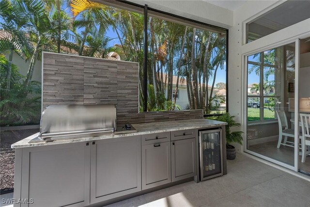 view of patio / terrace featuring wine cooler and area for grilling