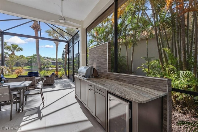 sunroom / solarium with wine cooler and healthy amount of natural light