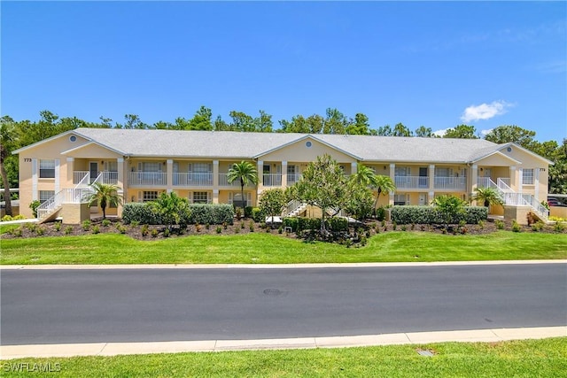 773 Wiggins Lake Dr Unit 102, Naples, FL 34110 - view of front of house featuring a front yard