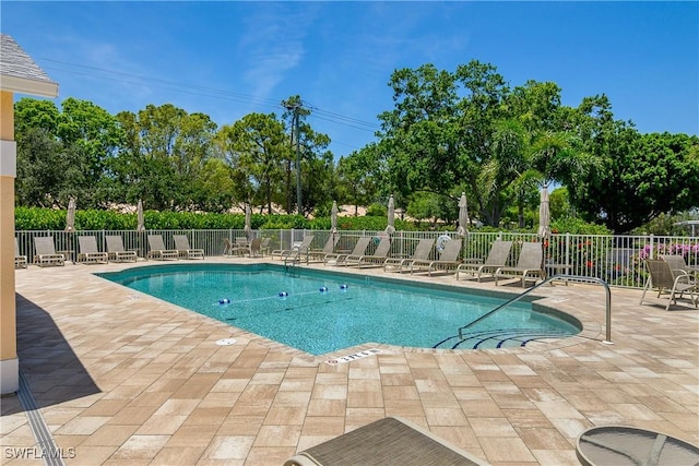 773 Wiggins Lake Dr Unit 102, Naples, FL 34110 - community pool featuring a patio