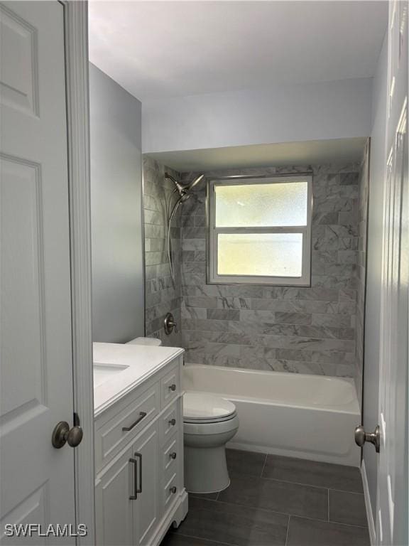 full bathroom featuring tile patterned floors, toilet, vanity, and shower / bath combination