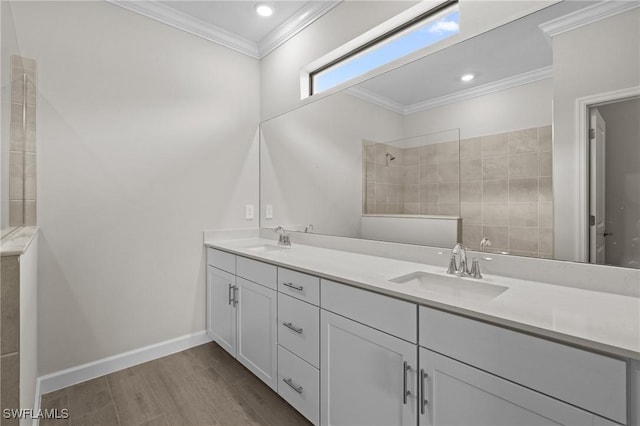 19402 Hinkley Dr, Estero, FL 33928 - bathroom with wood finished floors, walk in shower, double vanity, ornamental molding, and baseboards