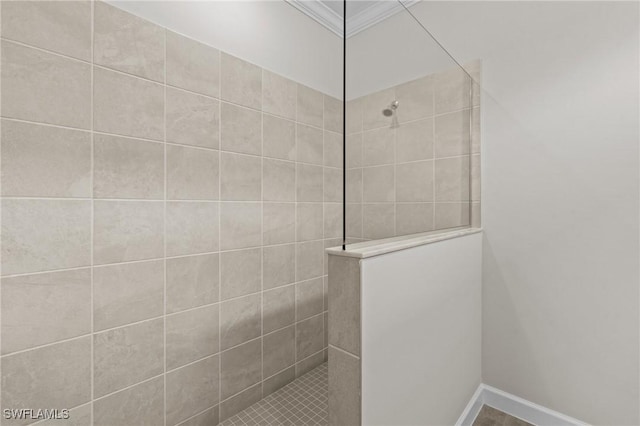 19402 Hinkley Dr, Estero, FL 33928 - bathroom featuring a walk in shower, crown molding, and baseboards