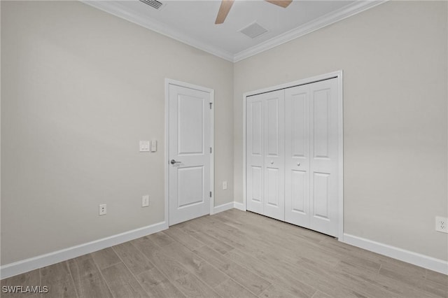 19402 Hinkley Dr, Estero, FL 33928 - unfurnished bedroom with ornamental molding, light wood-style floors, baseboards, a closet, and a ceiling fan