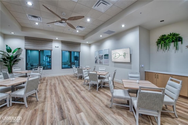 19402 Hinkley Dr, Estero, FL 33928 - dining space featuring light wood finished floors, baseboards, a drop ceiling, ceiling fan, and a raised ceiling