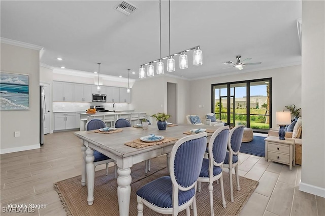 19402 Hinkley Dr, Estero, FL 33928 - dining area with ornamental molding, recessed lighting, a ceiling fan, baseboards, and light wood-type flooring