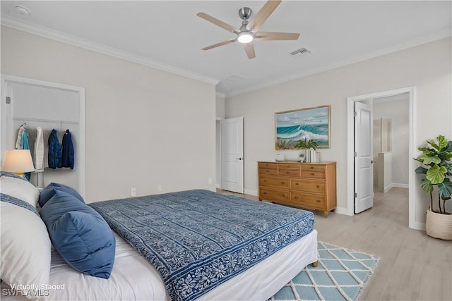 19402 Hinkley Dr, Estero, FL 33928 - bedroom featuring ornamental molding, light wood-style floors, baseboards, a ceiling fan, and a closet