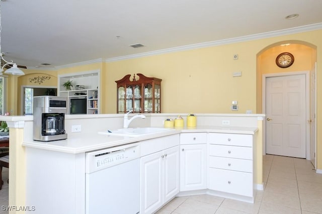 4873 Hampshire Ct Unit 5-101, Naples, FL 34112 - kitchen featuring dishwasher, light tile patterned floors, ornamental molding, a sink, and arched walkways