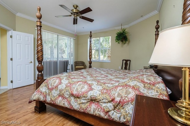4873 Hampshire Ct Unit 5-101, Naples, FL 34112 - bedroom featuring ornamental molding, a ceiling fan, and wood finished floors
