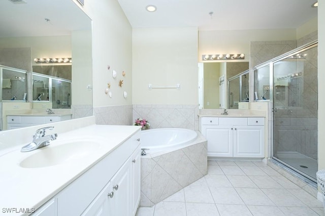 4873 Hampshire Ct Unit 5-101, Naples, FL 34112 - full bath featuring a sink, a garden tub, a shower stall, and tile patterned floors