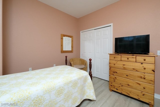 4873 Hampshire Ct Unit 5-101, Naples, FL 34112 - bedroom featuring light wood finished floors and a closet