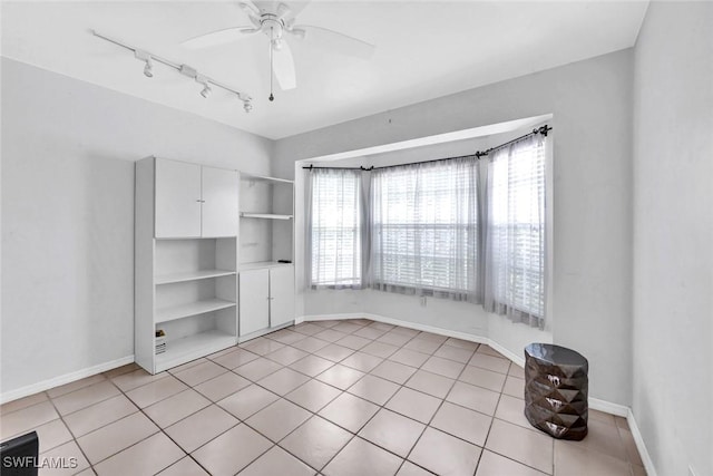 1273 Naples Lake Dr, Naples, FL 34104 - spare room featuring ceiling fan, baseboards, light tile patterned floors, and track lighting