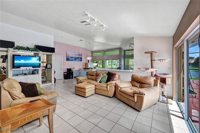 1273 Naples Lake Dr, Naples, FL 34104 - living room featuring vaulted ceiling, plenty of natural light, light tile patterned floors, and visible vents