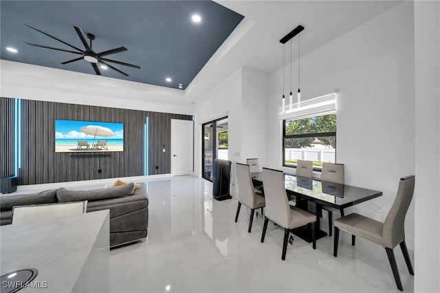 dining area with a tray ceiling, a ceiling fan, marble finish floor, and recessed lighting