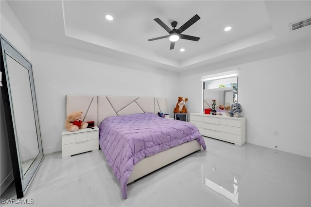 bedroom with marble finish floor, visible vents, recessed lighting, a ceiling fan, and a raised ceiling