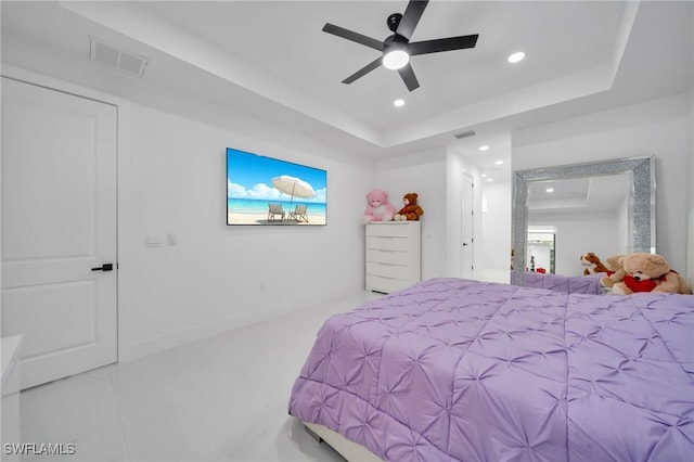 bedroom featuring a ceiling fan, recessed lighting, a tray ceiling, and visible vents