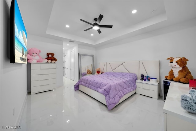 bedroom featuring baseboards, marble finish floor, a tray ceiling, and recessed lighting