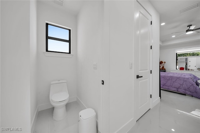 bathroom with toilet, recessed lighting, baseboards, and visible vents