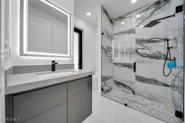 full bath featuring vanity, a marble finish shower, and recessed lighting
