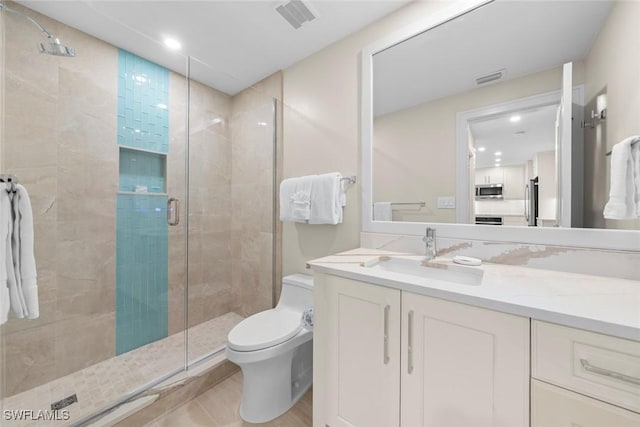 full bathroom featuring vanity, toilet, visible vents, and a shower stall