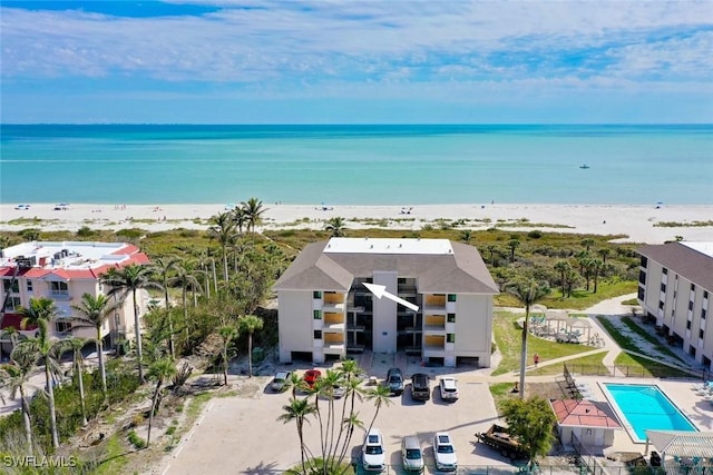 drone / aerial view featuring a view of the beach and a water view
