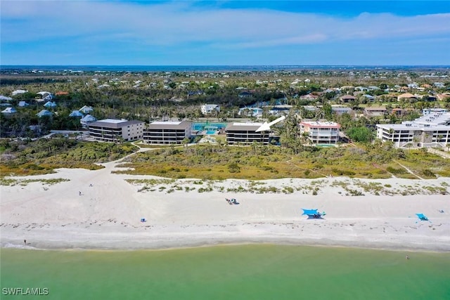 bird's eye view with a water view and a view of the beach