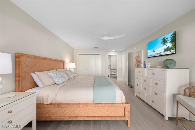 bedroom with a closet, ceiling fan, and wood finish floors