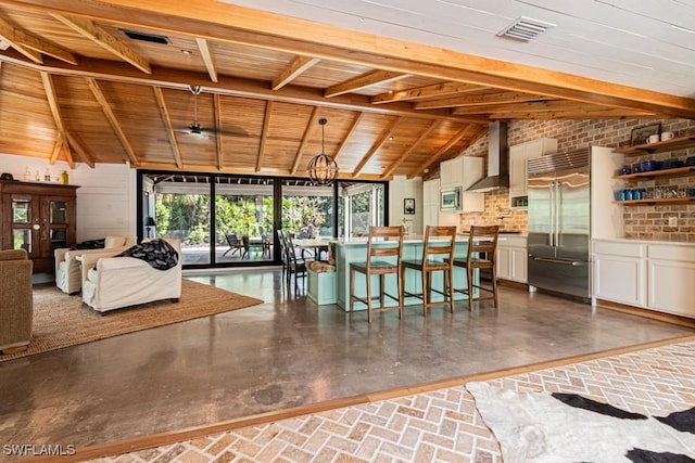 bar featuring built in appliances, wall chimney exhaust hood, wooden ceiling, pendant lighting, and a chandelier