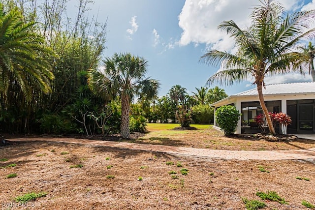 view of yard with a sunroom