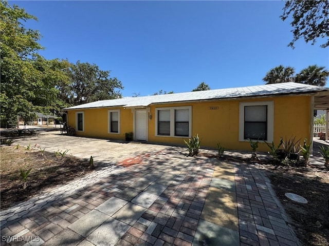 11688 Saunders Ave, Bonita Springs, FL 34135 - back of property featuring stucco siding
