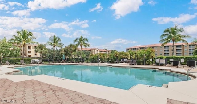 community pool featuring a patio area