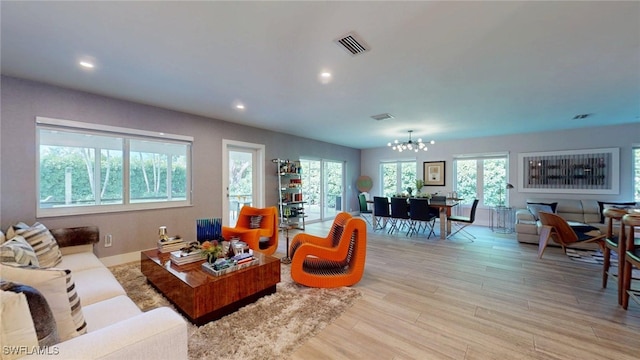 6600 SW 144th St, Coral Gables, FL 33158 - living room with a chandelier, light wood finished floors, and recessed lighting