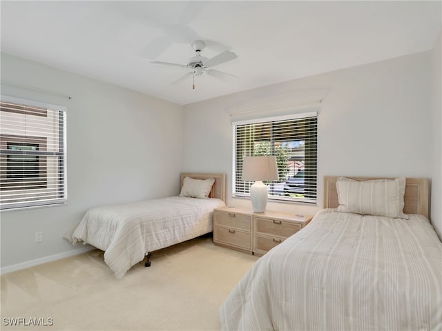 13111 Cross Creek Blvd Unit 208, Fort Myers, FL 33912 - bedroom with light colored carpet, baseboards, and a ceiling fan