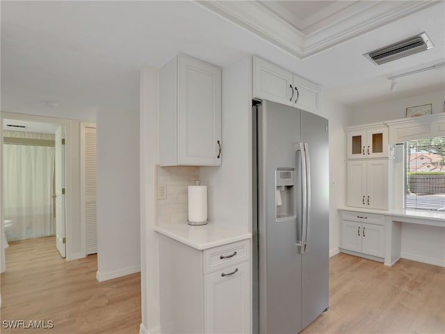 13111 Cross Creek Blvd Unit 208, Fort Myers, FL 33912 - kitchen featuring refrigerator with ice dispenser, light wood finished floors, white cabinets, light countertops, and ornamental molding