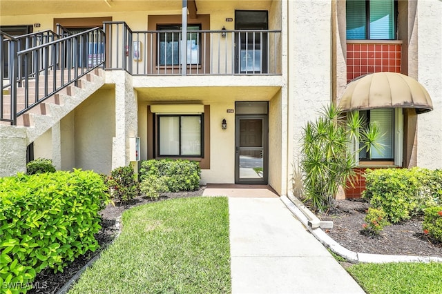 13111 Cross Creek Blvd Unit 208, Fort Myers, FL 33912 - view of exterior entry with stucco siding
