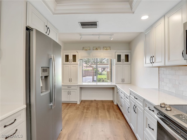 13111 Cross Creek Blvd Unit 208, Fort Myers, FL 33912 - kitchen featuring stainless steel appliances, white cabinetry, light wood finished floors, glass insert cabinets, and recessed lighting