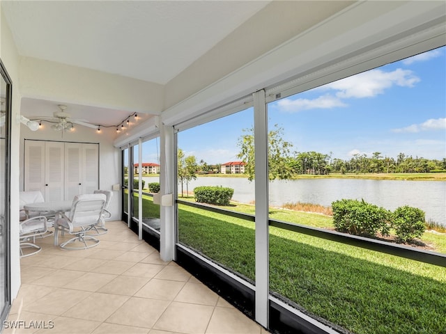 13111 Cross Creek Blvd Unit 208, Fort Myers, FL 33912 - sunroom / solarium with a water view, rail lighting, and a ceiling fan