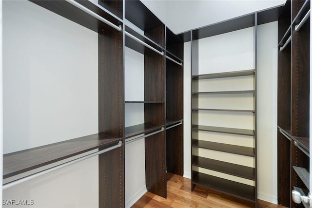26271 Devonshire Ct Unit 202, Bonita Springs, FL 34134 - walk in closet featuring wood finished floors