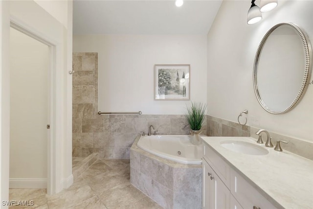 26271 Devonshire Ct Unit 202, Bonita Springs, FL 34134 - full bath featuring a tub with jets, vanity, and tile patterned flooring