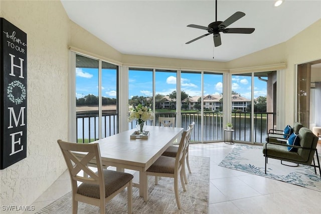 26271 Devonshire Ct Unit 202, Bonita Springs, FL 34134 - sunroom with a textured wall, a water view, tile patterned flooring, and vaulted ceiling